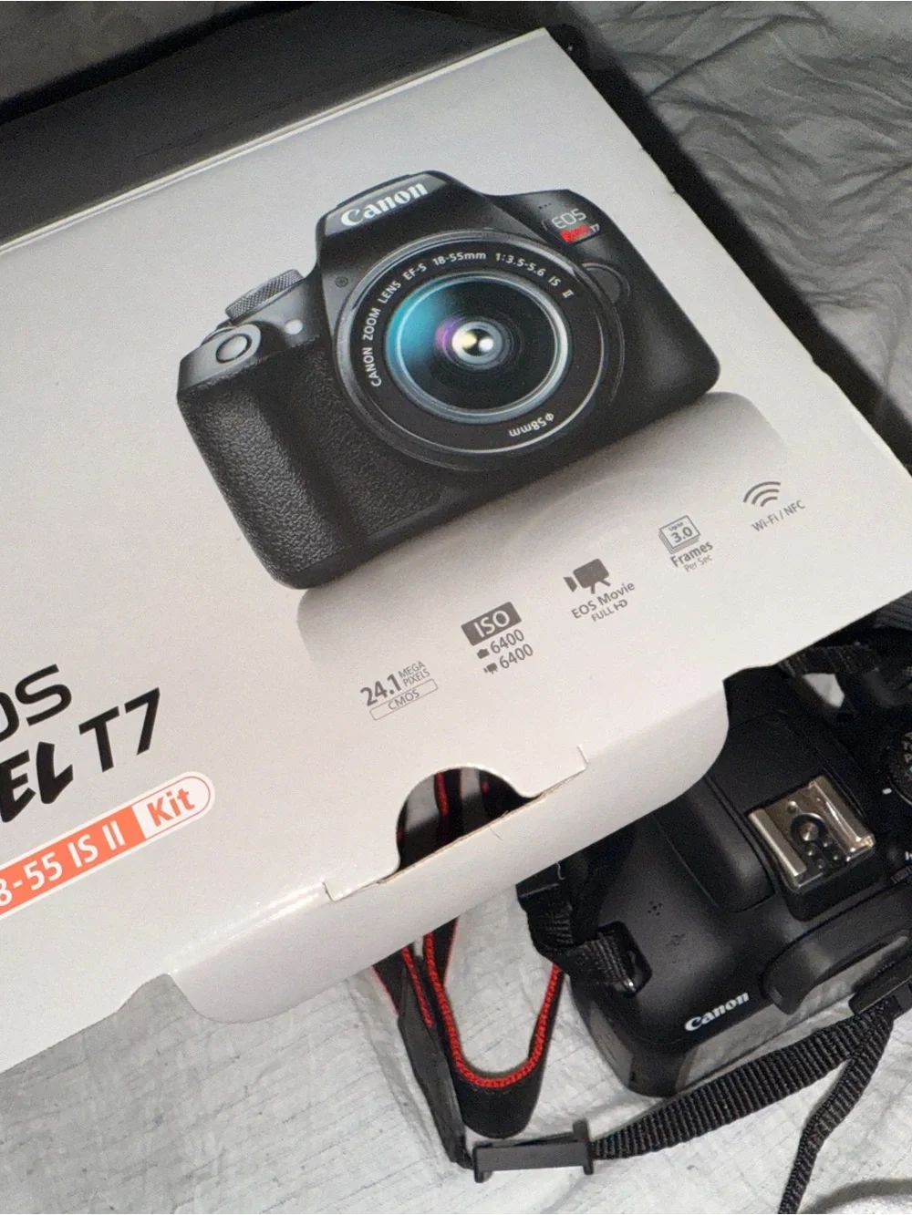 Canon DSLR Camera in Black with Red Strap Accent